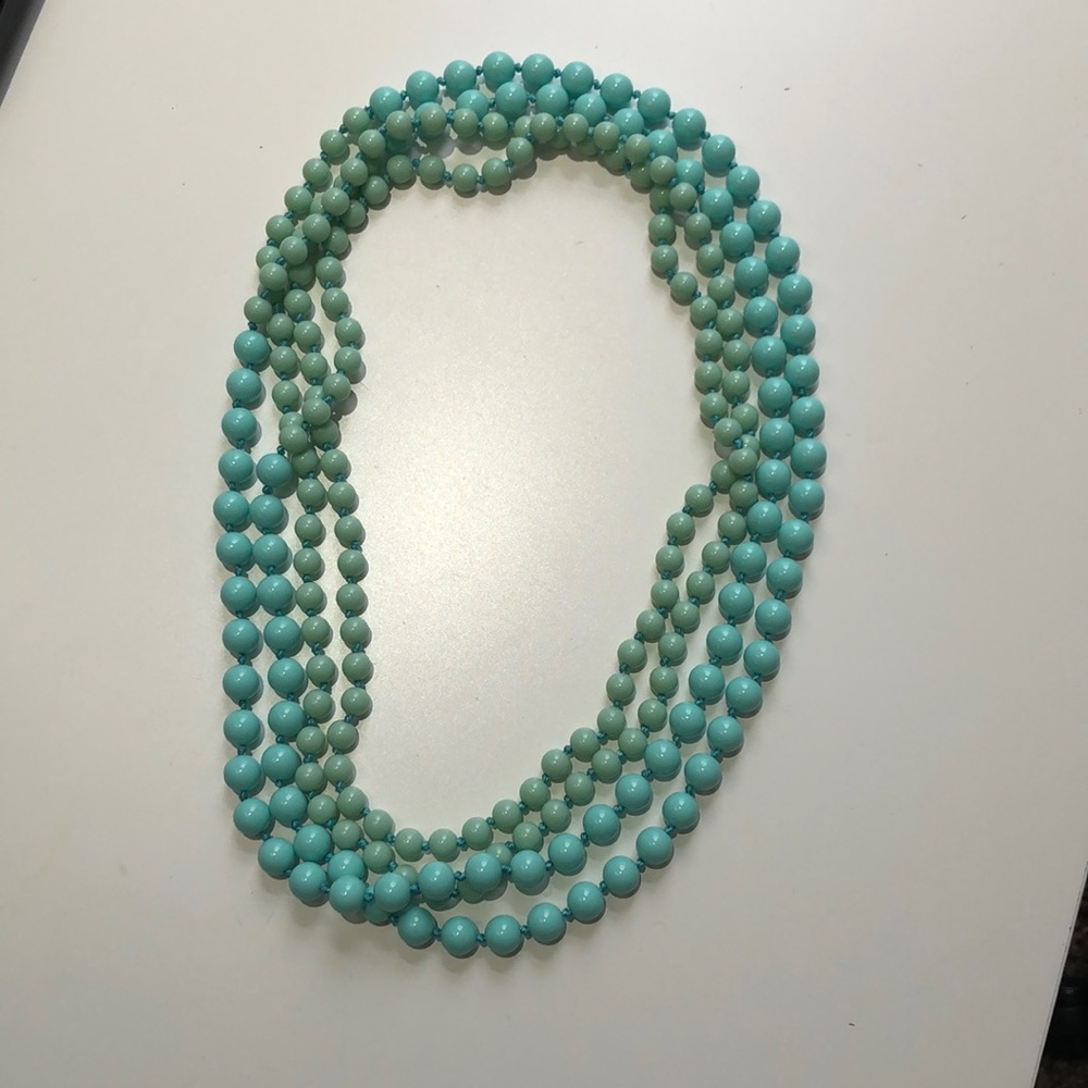 Teal necklace.
